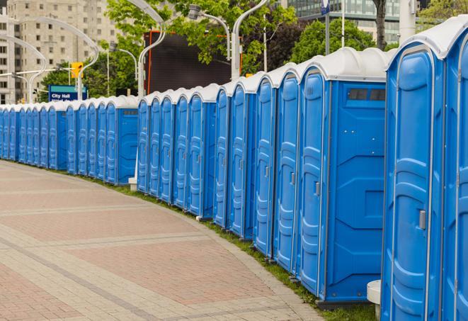 a row of portable restrooms at a fairground, offering visitors a clean and hassle-free experience in mountjoy